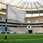 Fußballfeld mit Eckfahne und Tornetz in einem modernen Stadion vor dem WM 2026 Gruppenspiel der Gruppe B