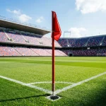 Fußballfeld mit Eckfahne und Tribüne eines voll besetzten Stadions für die WM 2026 Gruppe L Analyse